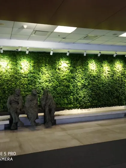 This indoor vertical garden brings a vibrant wall of green to a corporate lobby. We used strategic lighting to highlight the texture of the moss wall, creating a stunning focal point.