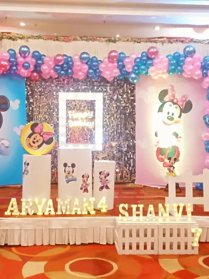 A closer look at the themed stage decor, showing the illuminated name and age signs. These personalized details make the celebration feel extra special for the children.