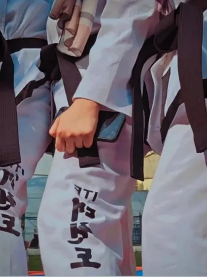 A close-up shot of the black belts, a symbol of mastery and commitment in Taekwondo.