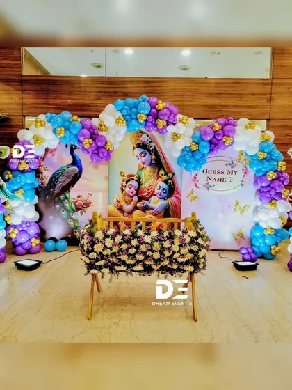 I bring a touch of divinity to naming ceremonies with this vibrant Little Krishna theme. The setup features a beautiful floral cradle, a colorful balloon arch, and playful Krishna cutouts, creating a joyful and blessed atmosphere.