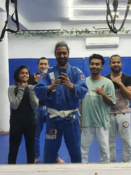 A mirror selfie capturing a moment of friendship and shared passion for Gi Jiu-Jitsu.