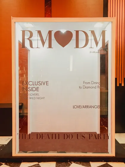 A life-size, magazine-cover photo booth was a favorite spot at the 'City of Dreams' party. It was a fun, interactive element that perfectly matched the glamorous theme.