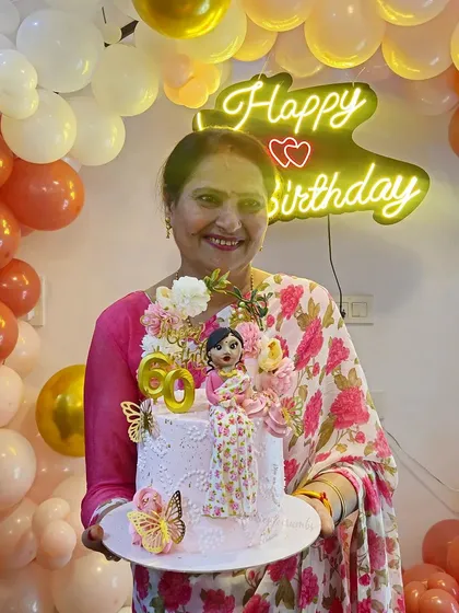 It's the best feeling to see my cake become a part of such a happy moment. I created this custom miniature doll cake for a 60th birthday, matching the fondant figure's saree to the birthday girl's actual outfit.