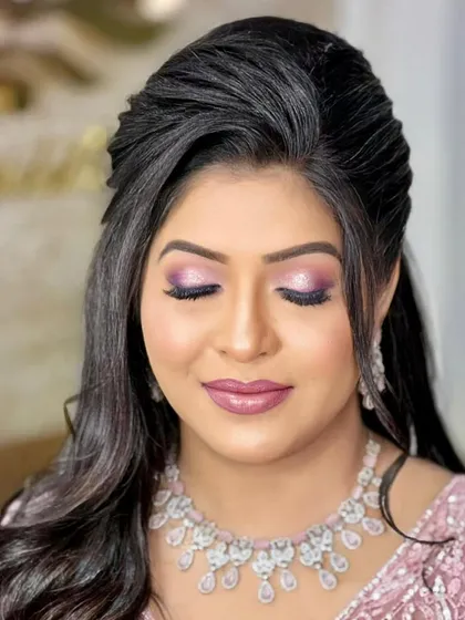 A close-up of a soft engagement glam look, featuring purple and pink eyeshadow.