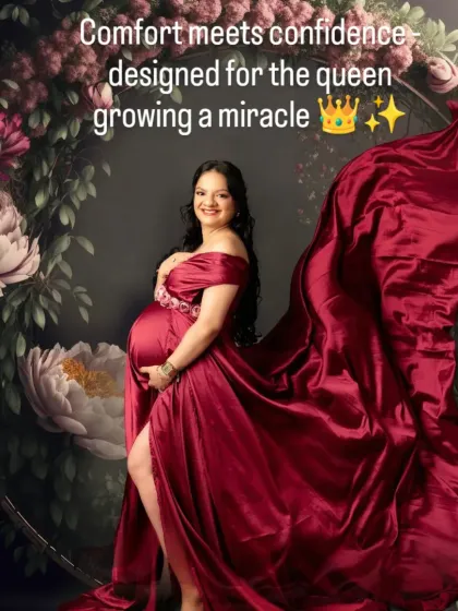 A truly royal portrait in our burgundy satin gown, with the flowing fabric creating a dramatic effect against a floral backdrop.