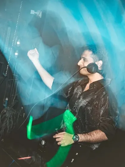A motion-blur shot capturing the dynamic energy and movement of my set during a retro-themed night.
