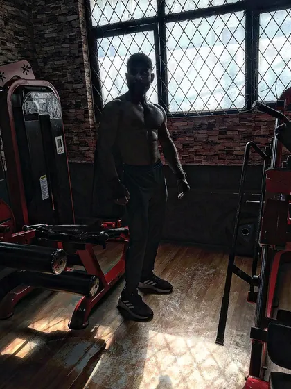 Strive for progress, not perfection. A silhouette shot in the gym.