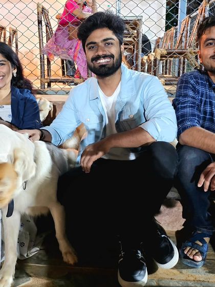 A group of friends enjoying their time at the park, surrounded by our friendly dogs.