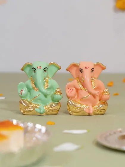 A pair of our pastel Ganesha idols in mint green and soft pink. They make a wonderful set for gifting or for creating a balanced and colorful display in your home.