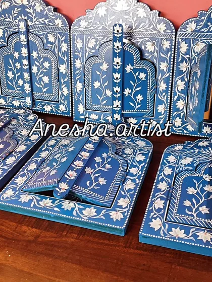 Inspired by the royal palaces of Jaipur, this collection of hand-painted wooden Jharokha frames brings a touch of Rajasthani heritage to your walls. Each piece features intricate floral patterns and can be customized as a mirror or a photo frame.