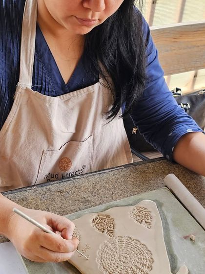 A few snapshots of corporate team members completely absorbed in their creative process. They are making everything from decorative nameplates to unique bowls during our hand-building workshop.