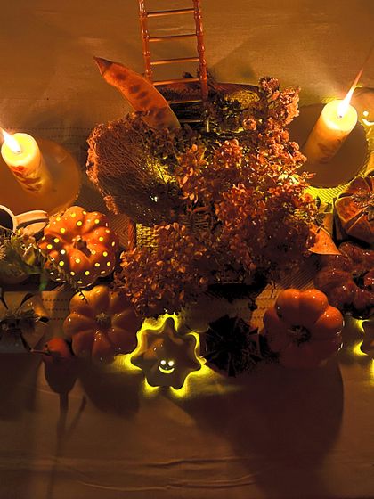 Embrace Autumn with timeless ceramic decor. This photo shows my pumpkin and ghost tealight holders glowing in the dark, creating a magical and spooky ambiance.