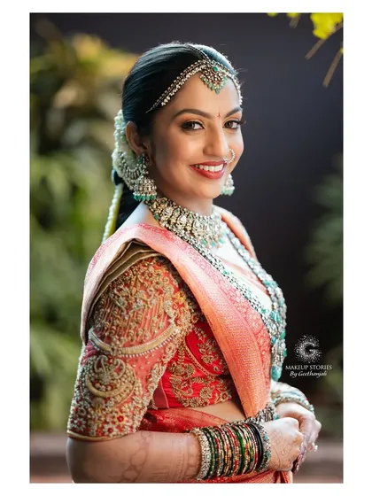 Likitha glowing with happiness on her wedding day. Her makeup was designed to be long lasting and picture perfect from every angle, ensuring she looked flawless throughout the long hours of her traditional ceremony.