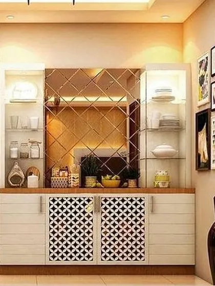 A beautiful crockery unit designed for a dining area. It combines open glass shelves for display with patterned cabinet doors for storage, complemented by a mirrored backsplash to enhance the sense of space.