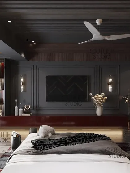 Dark aesthetics define this bedroom. The design uses a dark color palette, a bold red media console, and dramatic lighting to create a space that is moody, modern, and luxurious.