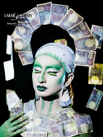 A conceptual fantasy look based on the theme of money. This creative makeup uses currency notes and green body paint to make a bold artistic statement.