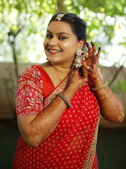 A playful moment during the Haldi ceremony. The waterproof and long-lasting makeup ensures she looks perfect throughout all the rituals.