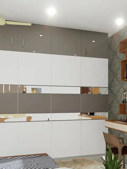 A bedroom design featuring a two-tone grey and white wardrobe with a mirrored strip. The adjacent wall has a built-in study desk and bookshelf.