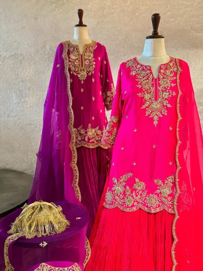 This collection features stunning sharara sets in vibrant jewel tones. The rich pink and magenta outfits are detailed with fine embroidery, making them ideal for festive gatherings.
