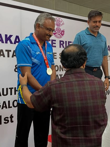 Congratulating one of our senior shooters on his medal-winning performance. Age is no barrier to success in this sport.