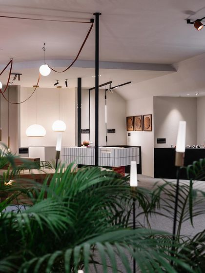 Another view of our Acetech booth, showcasing a variety of our pendant, track, and floor lighting. The space was carefully planned to manage foot traffic and encourage meaningful interactions.