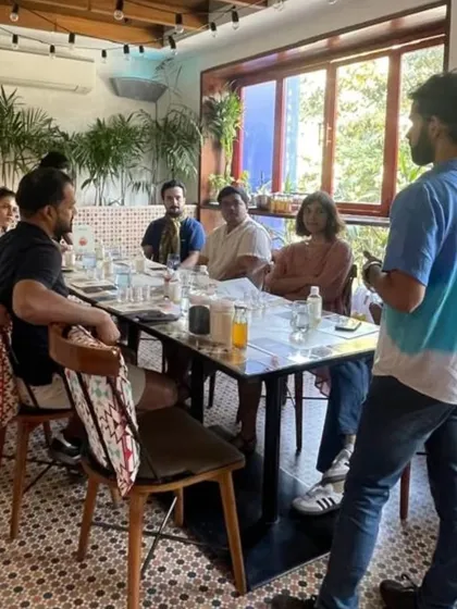An instructor leads a discussion with an attentive group during a kombucha session. Our workshops are interactive, with plenty of time for questions and shared learning.