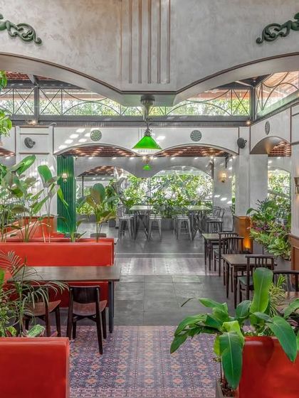 Looking through the colonial archways at Adda 1522, this view captures the layers of the space. The design uses architectural elements to frame views and create a sense of depth and discovery.