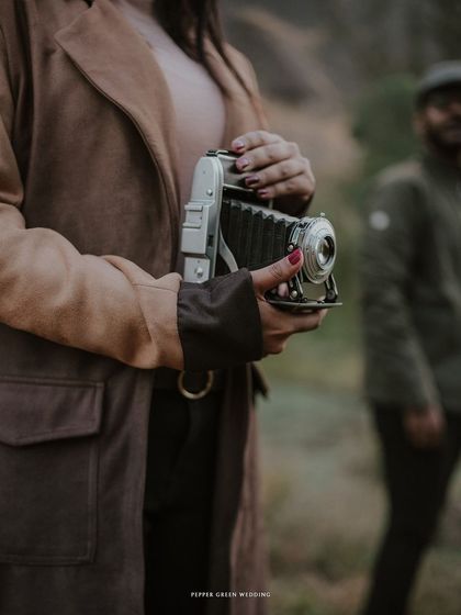 A detail shot of the vintage camera from Ananthu and Sarga's themed shoot. Small details like this help to build a unique narrative for your pre-wedding story.