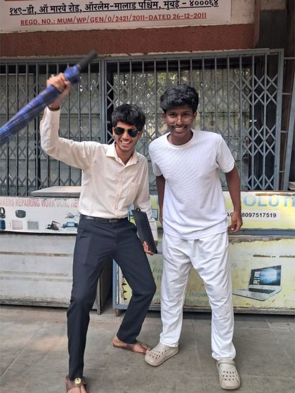 "Chhatri ke neeche aaja." Two students have fun recreating a classic Bollywood pose during our theme day.