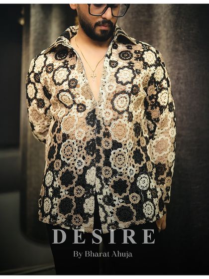 A close-up on the intricate pattern. The craftsmanship is evident in every detail, making it a true piece of luxury menswear.