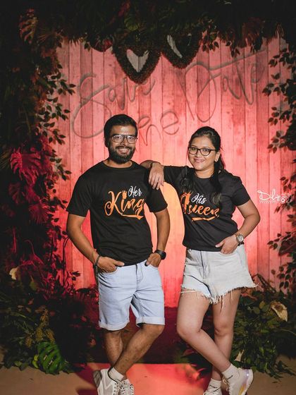 A fun couple's portrait with matching 'His King' and 'Her Queen' t-shirts, a great prop for a personalized shoot.