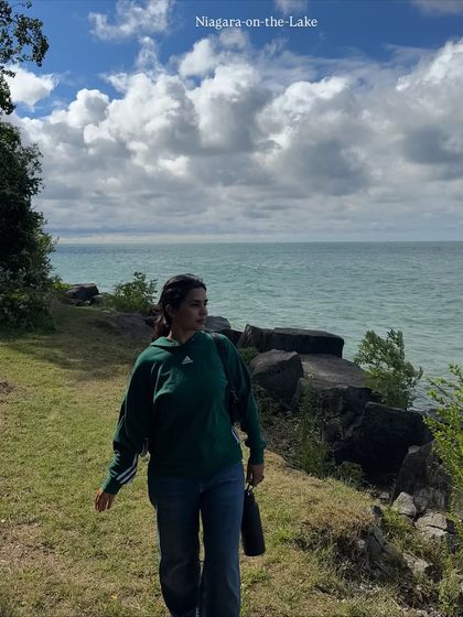 A candid walking shot at Niagara-on-the-Lake. This shows a casual, comfortable outfit in a beautiful natural setting.