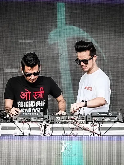 Back to back, mixing for a huge outdoor crowd on Friendship Day in Indore.