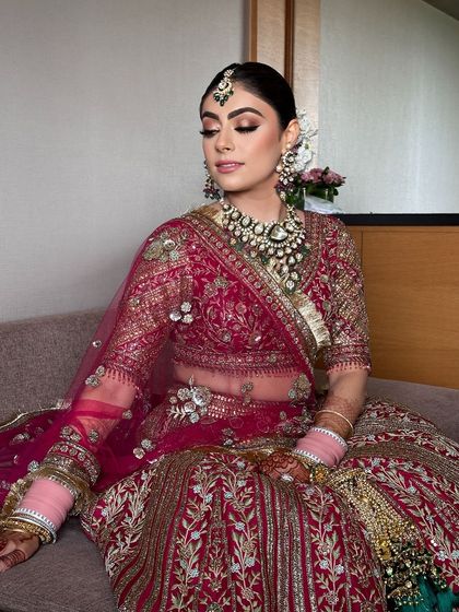 A close-up of the bride's soft glam makeup and her neat, elegant bridal bun.