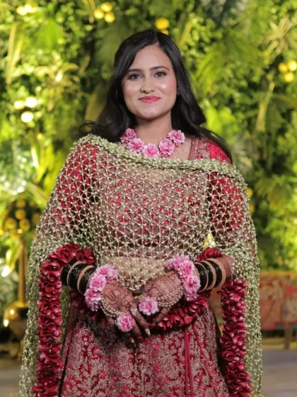A front-facing view of the bride in her floral dupatta and matching hathphool. I can create coordinated accessories to complete your entire floral look.