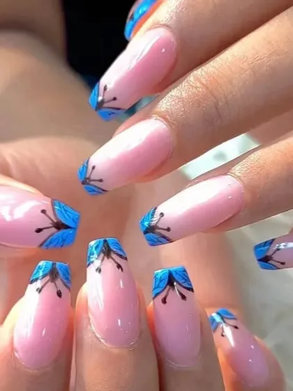 A close-up of the unique blue floral tip design.
