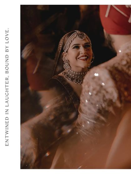 A beautiful, candid shot of the bride laughing, her joy lighting up the frame, captured through a crystal for an artistic effect.