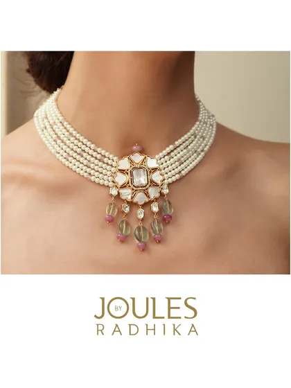 A clean shot of the classic pearl choker with a central polki pendant, highlighting its elegant and versatile design.