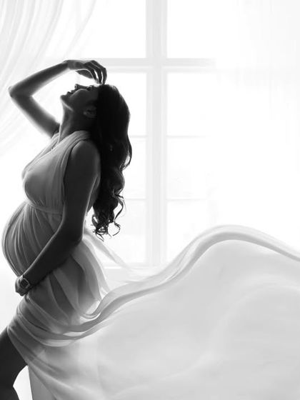 This is pure art! I created this dramatic silhouette by backlighting the mom-to-be against a bright window. The black and white edit emphasizes her beautiful shape and the incredible texture of the flowing fabric.