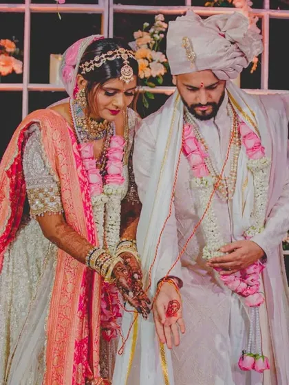 A sacred moment during the pheras, where the couple makes their vows. We ensure the sanctity of these rituals is maintained amidst the grand celebration.