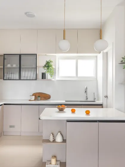 My kitchens are designed to be the functional and beautiful heart of the home. This open island kitchen uses a light beige palette with sleek black accents, quartz countertops, and elegant pendant lighting to create an airy, sophisticated space for cooking and gathering.