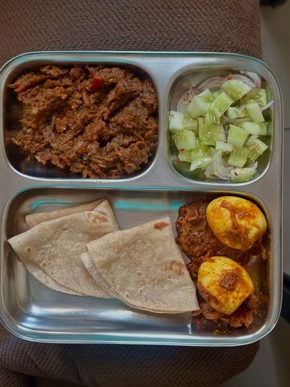 A repeat of the delicious eggetarian meal with chapati, baingan bharta, masala boiled eggs, and salad.