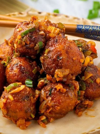 The perfect Indo-Chinese twist. Our Veg Manchurian features crispy vegetable balls tossed in a savory and tangy sauce, a favorite starter for all ages.