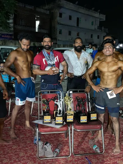 Posing with the trophies after a successful competition night. We came, we saw, we conquered. This is what happens when you commit to the grind.