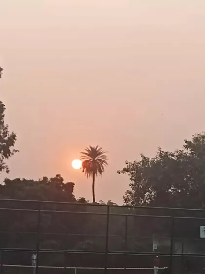 The sun sets over our Noida tennis facility. A calm end to a day of intense training and competitive matches, highlighting the serene yet professional environment we cultivate.