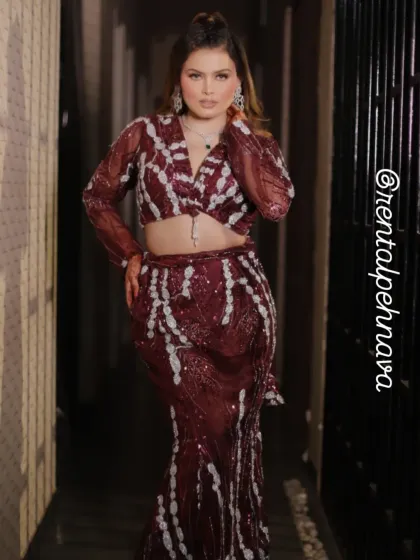 A full-length photo of the maroon and silver drape saree. The rental for this beautiful outfit is only ₹2000.