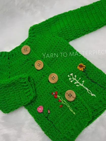 The full view of my green floral embroidered sweater, showing the comfortable fit and charming wooden button details that make it both practical and beautiful.