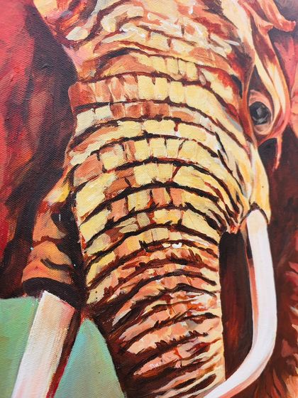 A close-up of the elephant canvas, showing the texture and layering of the acrylic paint. Every brushstroke is intentional, building depth and emotion into the final piece.