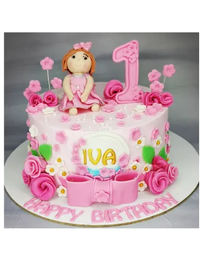 A pink floral first birthday cake inspired by an AI image. This eggless choco-chip cake is decorated with intricate pink flowers and a cute doll topper.