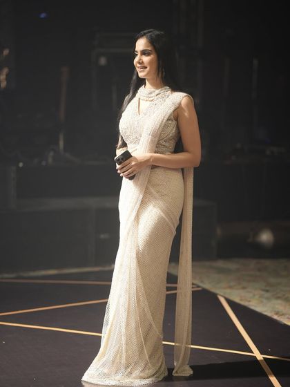 A candid moment on stage during the anniversary event. My role is to share the couple's story and create a warm, celebratory atmosphere.